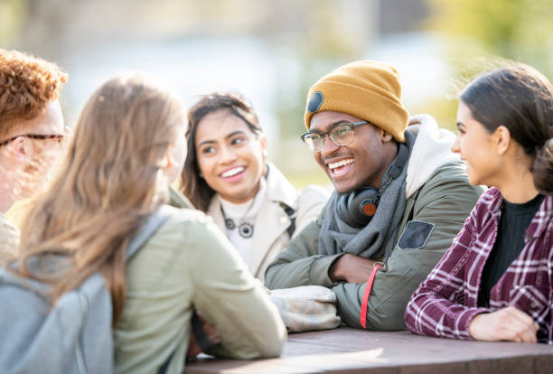 Student talking at a table